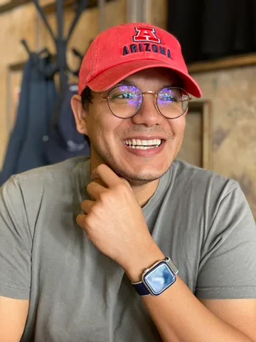 Krystian Flores smiling in an Arizona cap